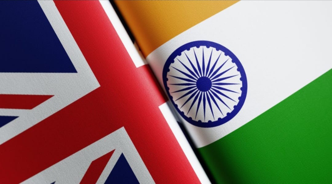United Kingdom and India flags flying side by side
